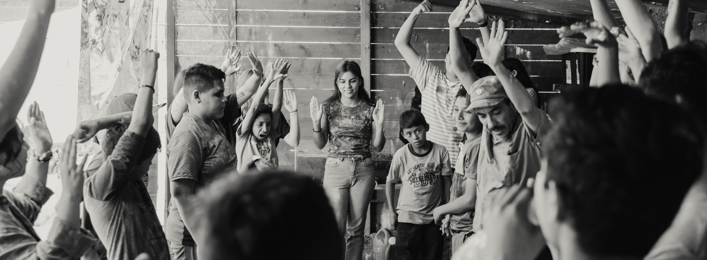 Children raising their hands